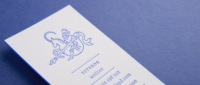 A minimalistic business card with a bold, creative logo portraying a night on a mystical creature