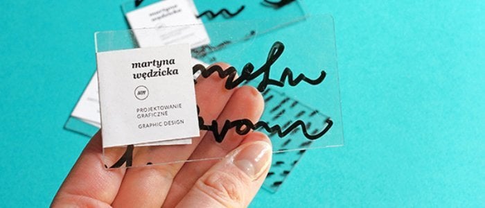 Transparent, plastic business card with a marker writing